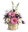 spring basket with assorted spring flowers