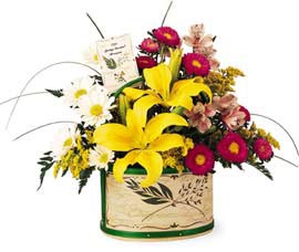 basket filled with Yellow Lilies Pink Asters, Alstroemeria and white daisy Pompons