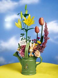 peter rabbit watering can with fresh spring flowers