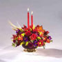 fall arrangement with autumn colored flowers such as mini Carnations, Daisy Pompons, Mini Lilies, Aster and Lilies.