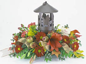 fall colored arrangement filled with flowers such as, roses, wheat, fall mums that 	is great for the holidays