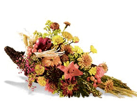 fall arrangement filled with flowers such as fall mums, alstroemeria, and yellow 	aster